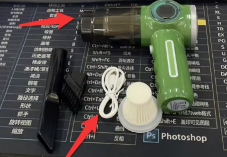 A handheld vacuum cleaner in green color being used on a car seat, showing the vacuum head inserted into a crevice tool.