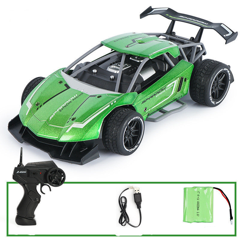 Green remote control car with included accessories on a white background