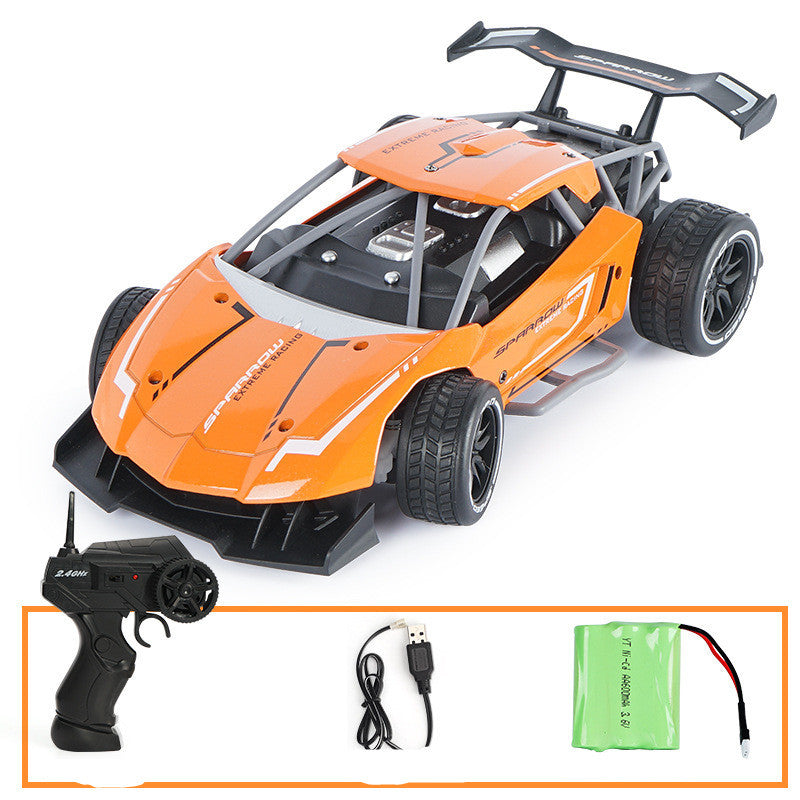 Orange remote control car with accessories on a white background