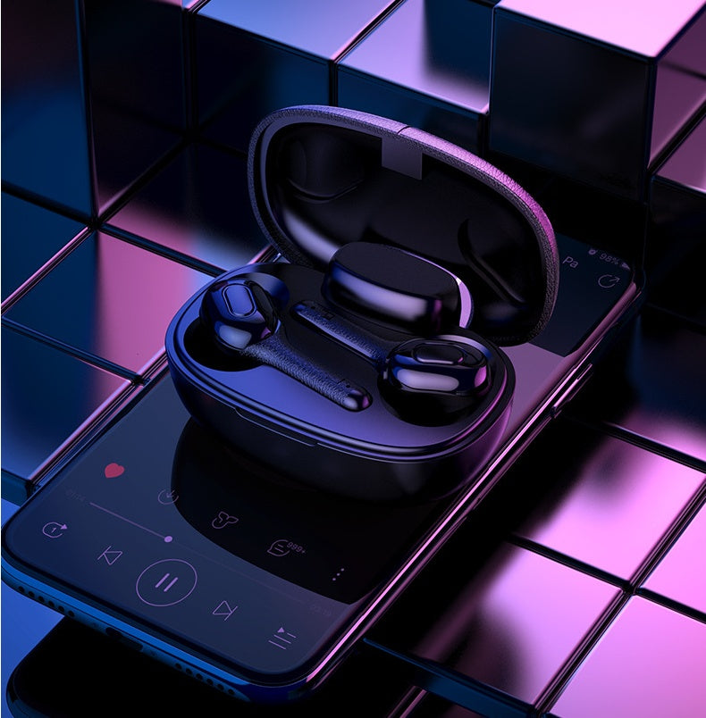A pair of T9s translation Bluetooth earbuds placed on a phone .