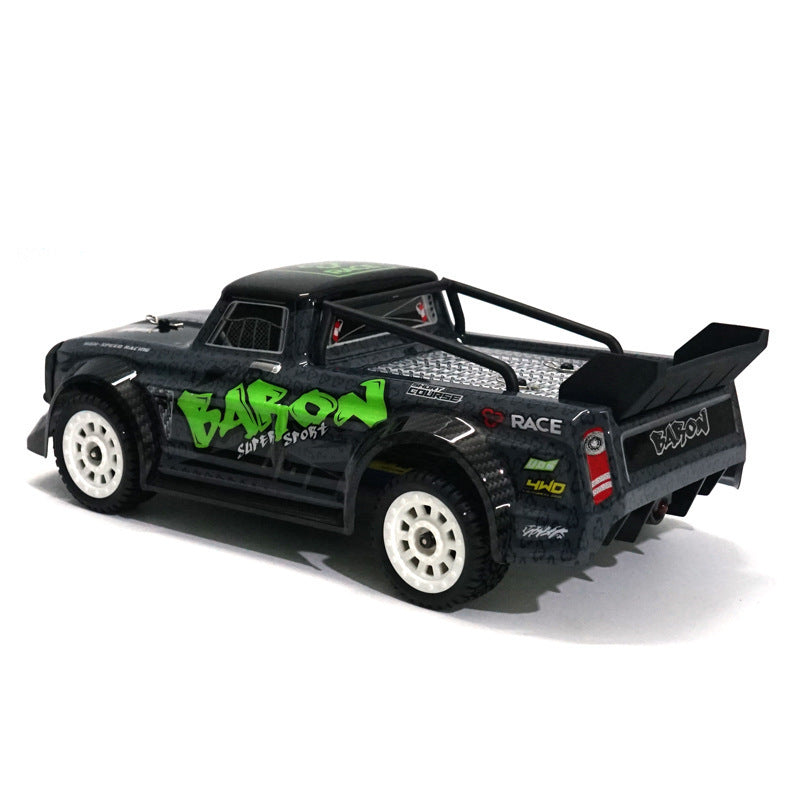 Black toy truck with green and white text on a white background