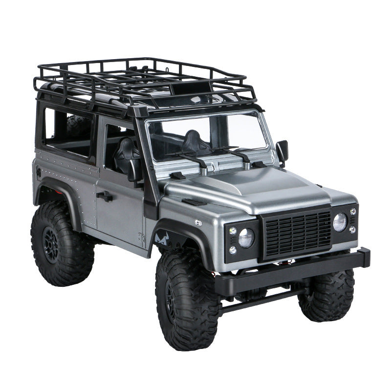  Front-side angle of realistic scale model RC truck with roll cage and side mirrors.