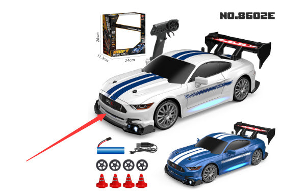 RC drift car kit No.8602E with two racing cars, controller, battery pack, spare tires, and cones.