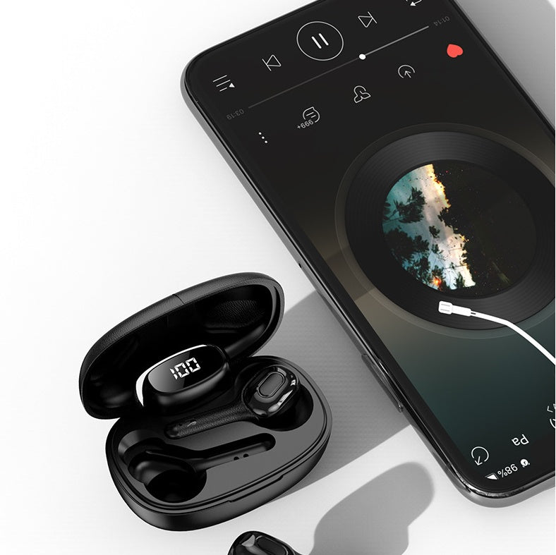 Black wireless Bluetooth earbuds with LED charging case placed beside a smartphone playing music, showcasing modern design and audio compatibility