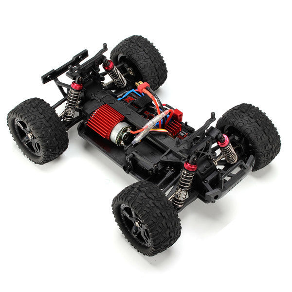 Smax RC truck chassis showcasing suspension system, brushless motor, and internal electronics