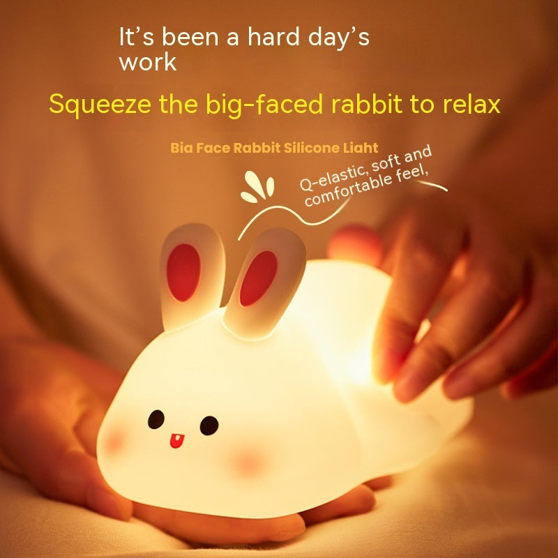 Squeeze the big-faced rabbit to relax .