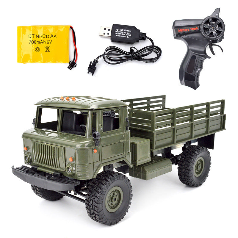 Green military RC truck with remote control, battery, and USB charger