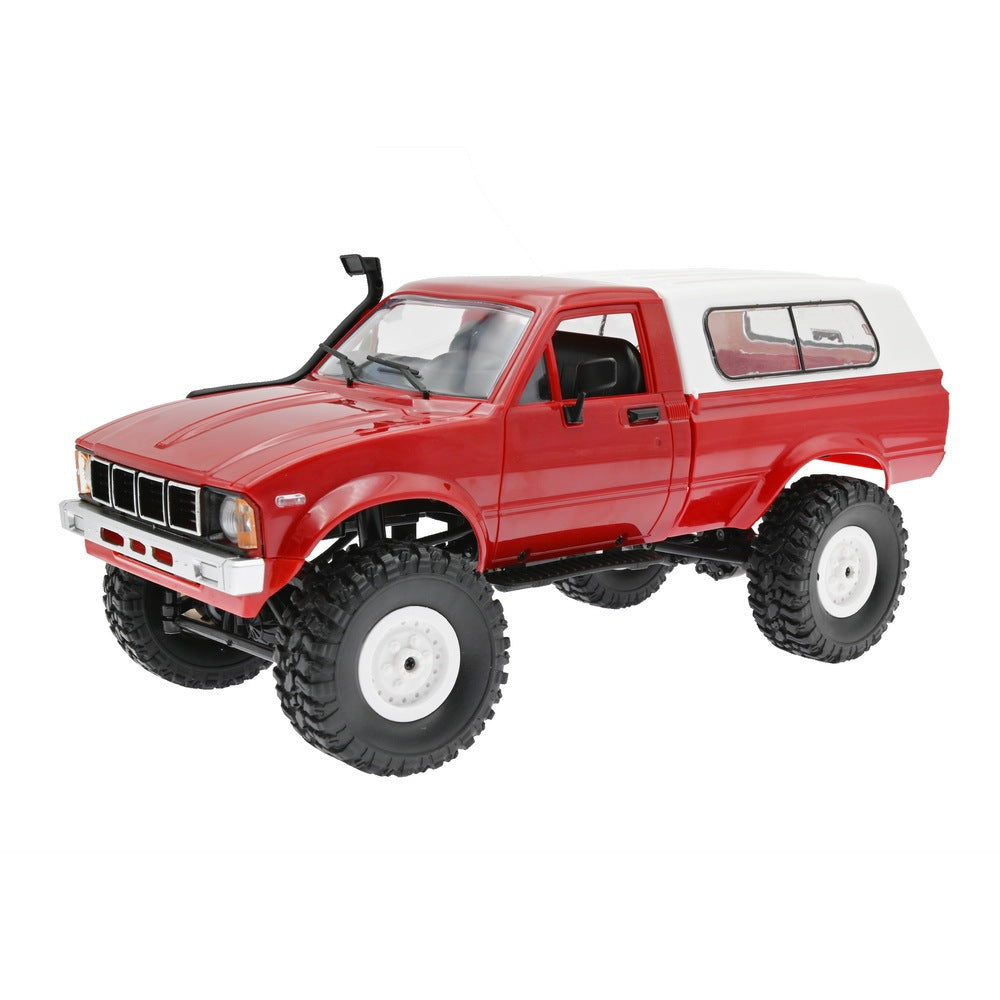 Red toy truck with large wheels on a white background