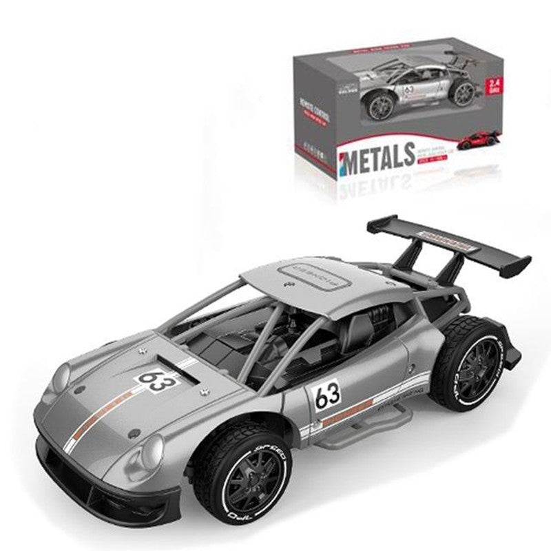 Model car with number 63 and a box labeled 'Metals' on a white background
