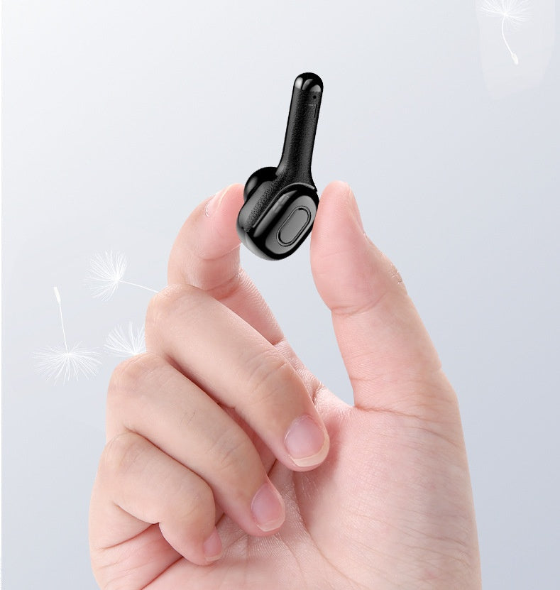 Close-up of hand holding a lightweight black wireless Bluetooth earbud, highlighting its compact, ergonomic design and portable convenience.