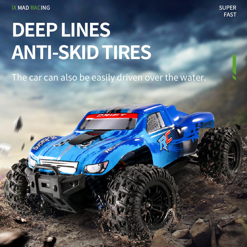 Blue RC off-road truck with deep-tread anti-skid tires splashing through terrain