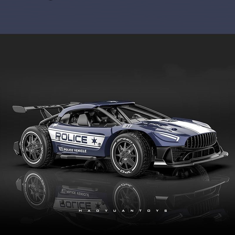 Model police car with reflective surface on a dark background