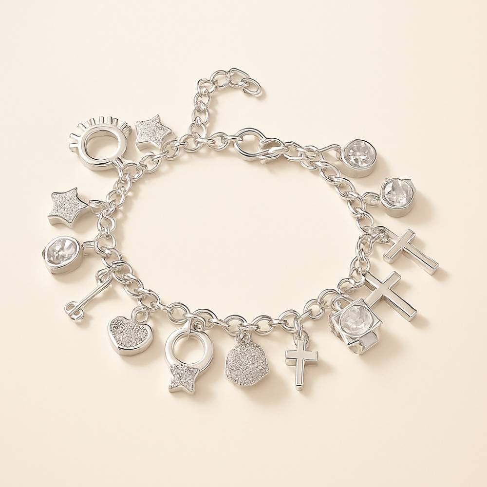 Silver charm bracelet with various charms on a beige background
