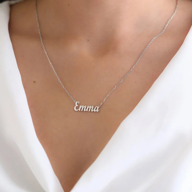 Silver 'Emma' necklace on a person wearing a white top