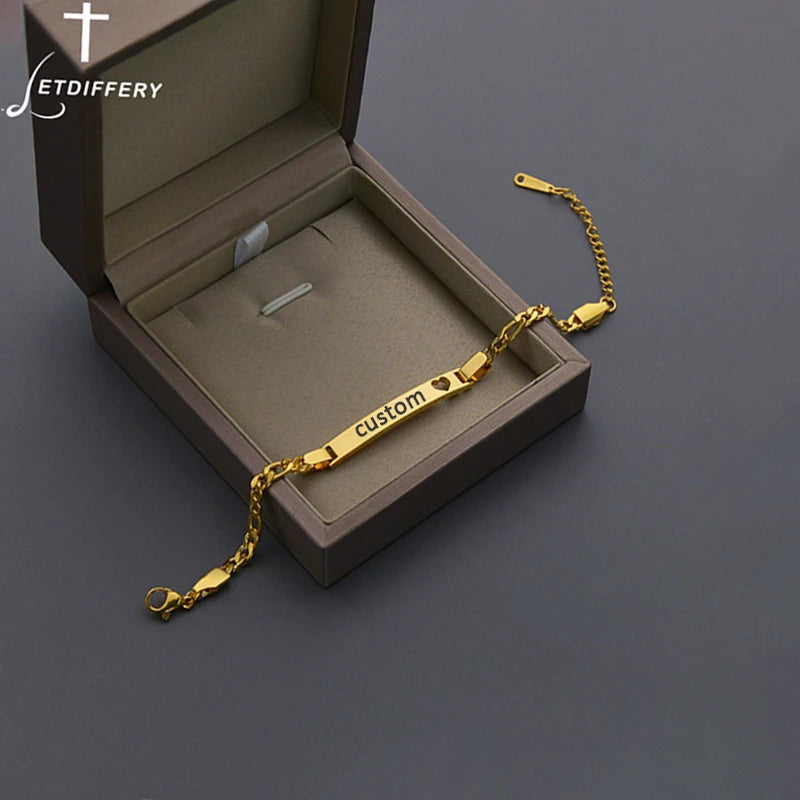 Gold bracelet with 'custom' engraving in an open brown box on a dark background, featuring the brand 'JETDIFFERY'.