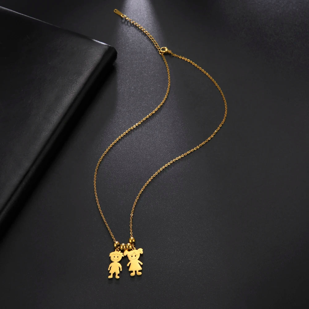 Gold necklace with two bear pendants on a black background