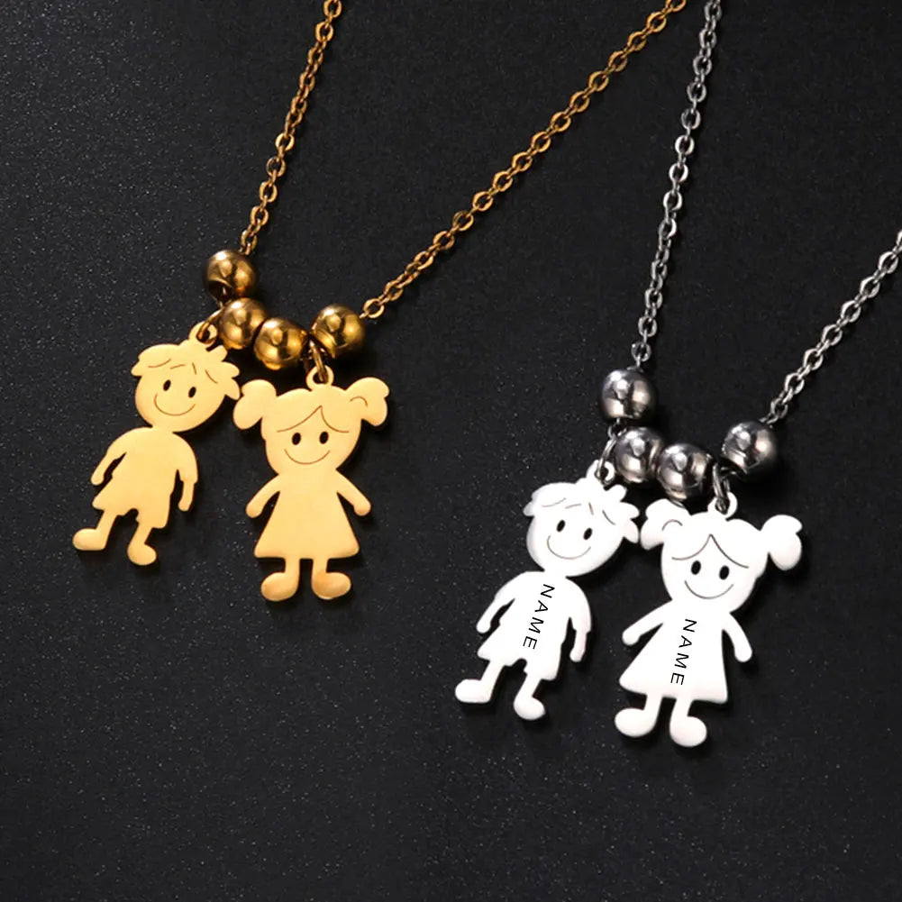 Two necklaces with child-shaped pendants on a black background