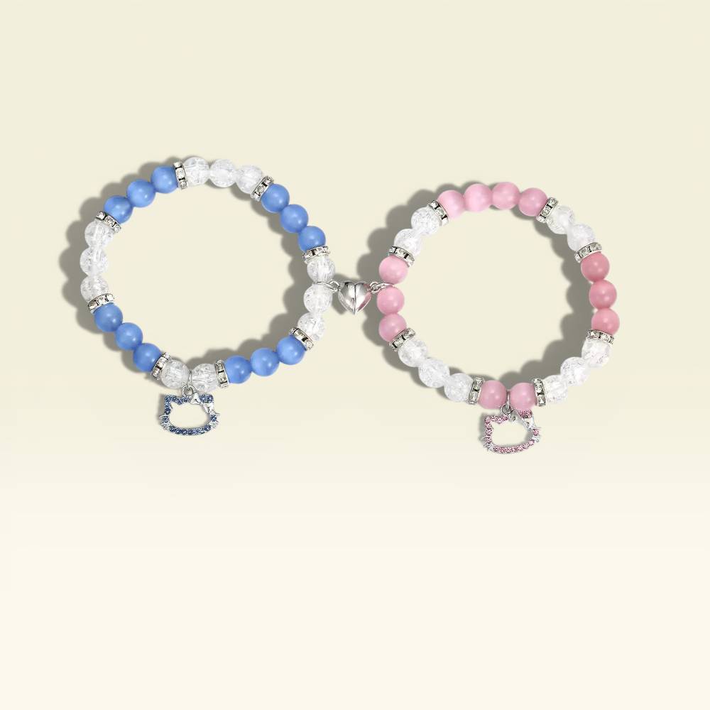 Two beaded bracelets, one blue and white, the other pink and white, on a light beige background.