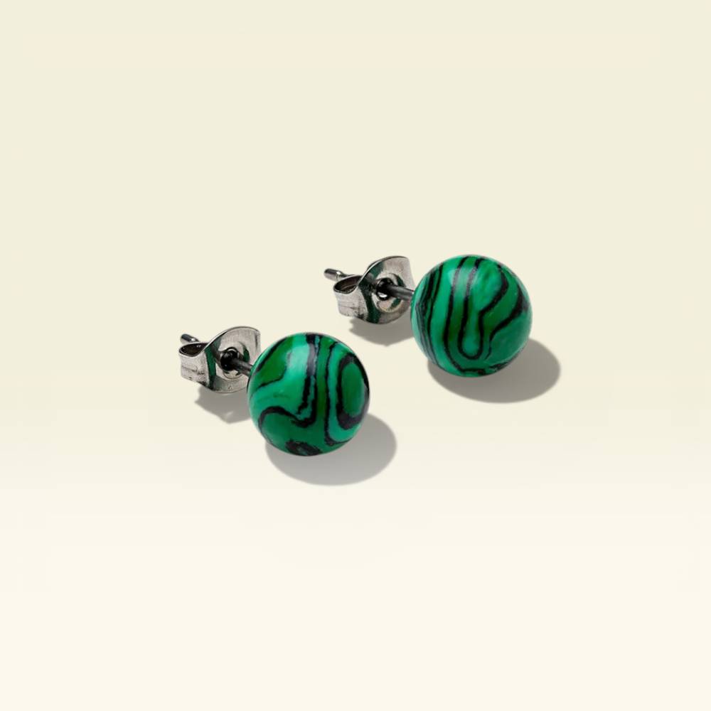 Green marbled round earrings on a beige background