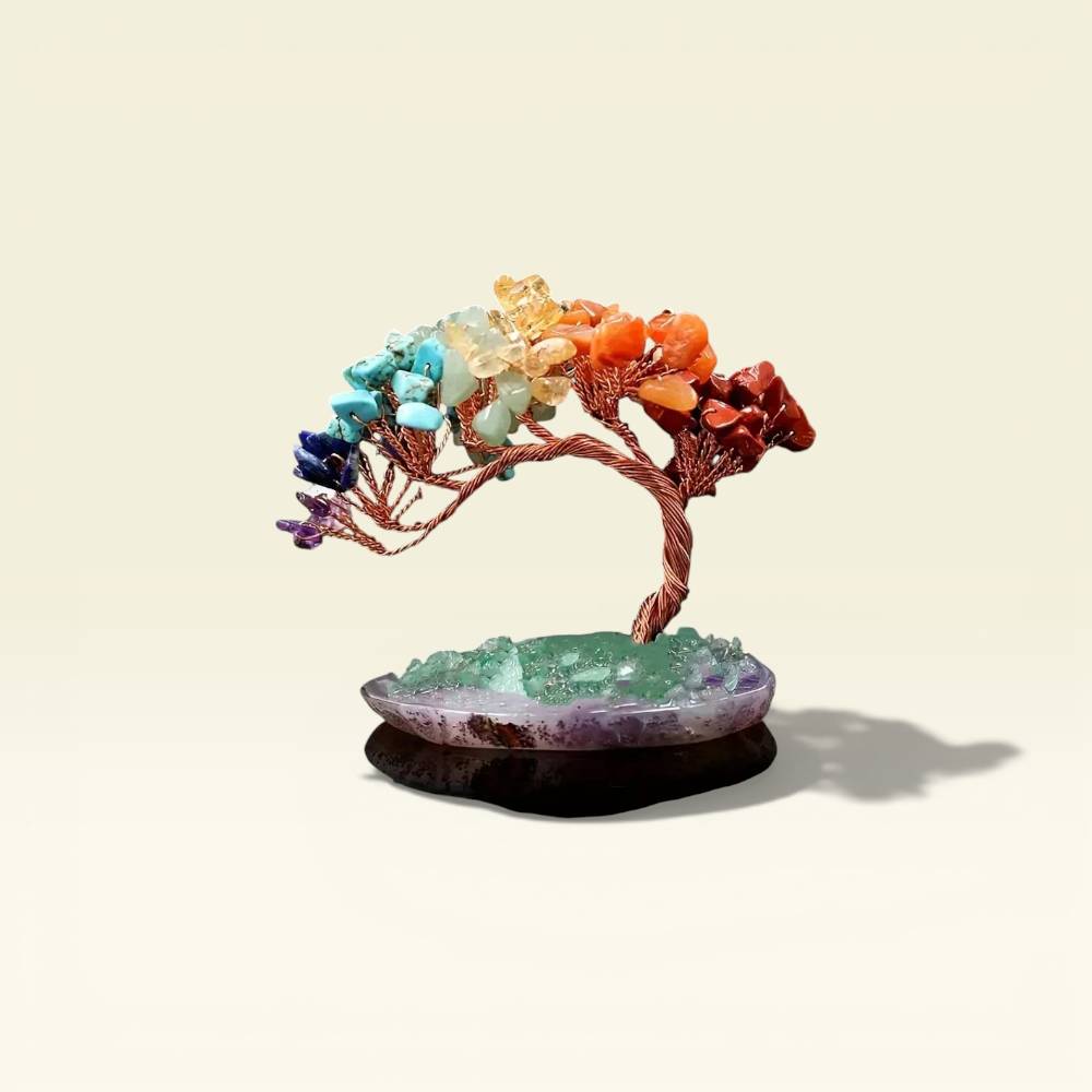 Decorative piece with a tree-like structure made of colorful stones on a beige background