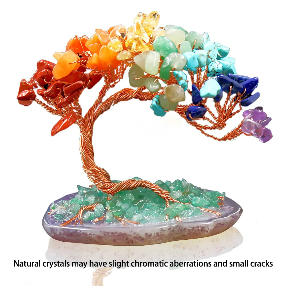 Decorative crystal tree with multicolored stones on a white background