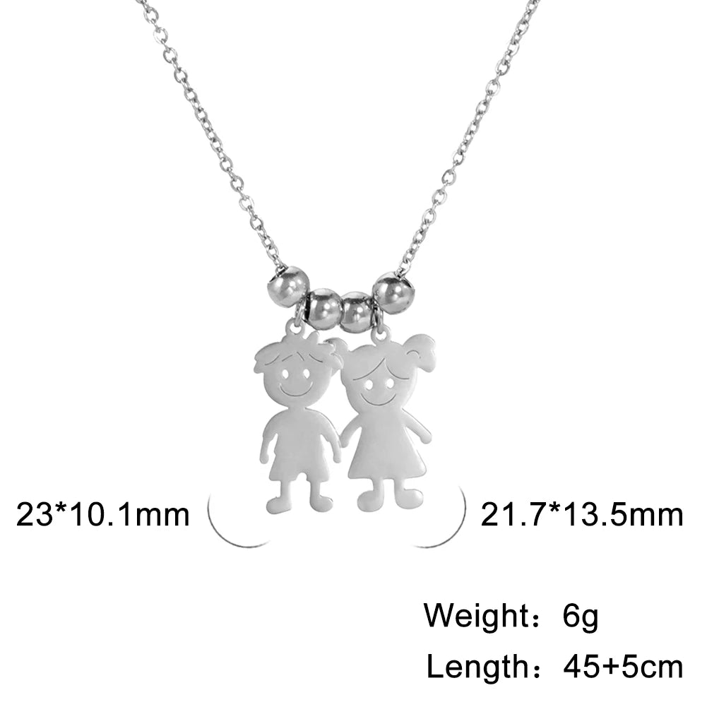 Silver necklace with two child-shaped pendants on a white background
