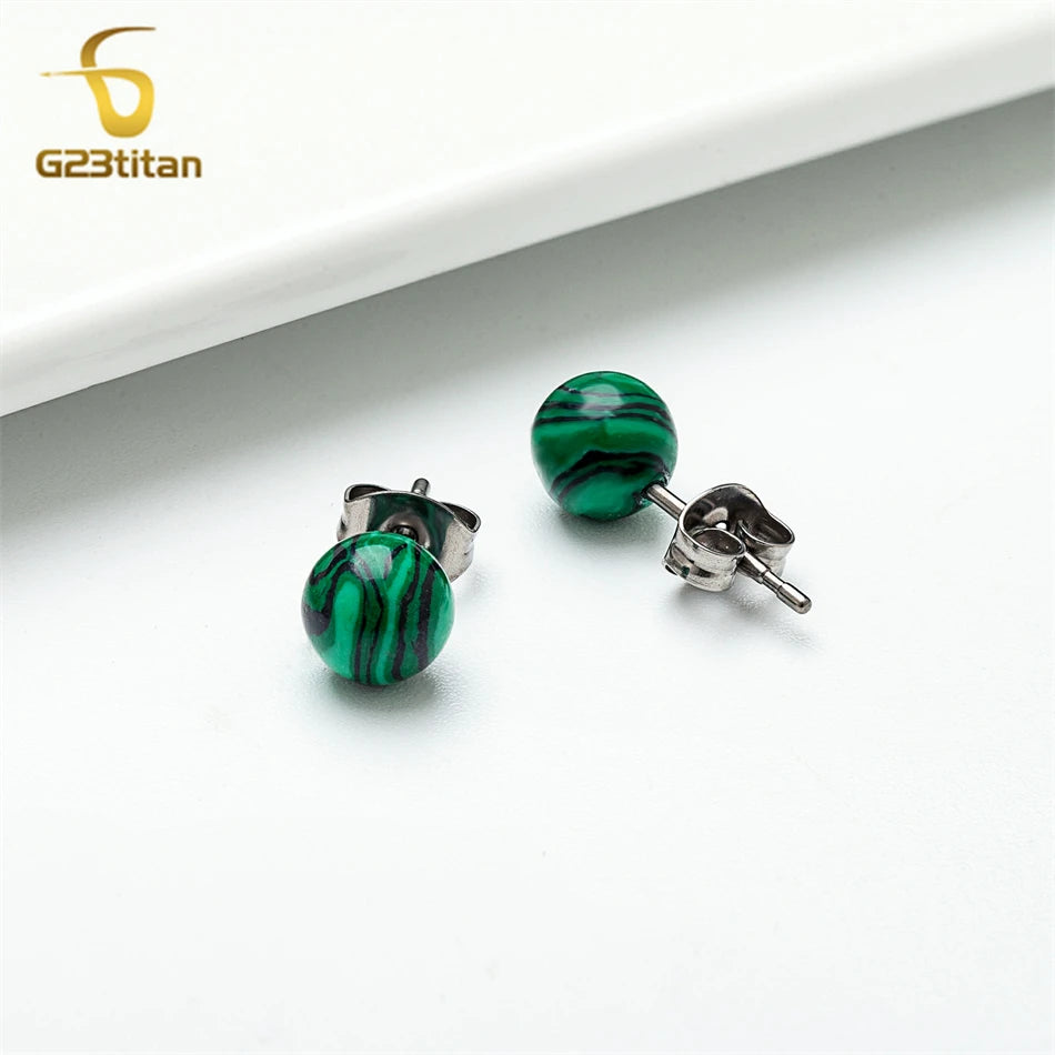 Green marbled stud earrings on a white background with G23Titan logo.