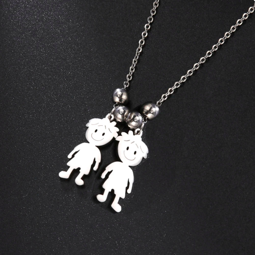 Necklace with two white pendant figures on a black background