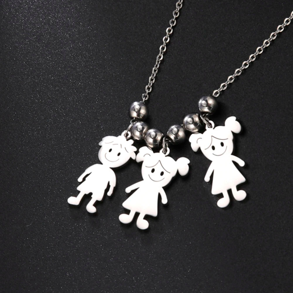 Necklace with three white cartoon-style character pendants on a black background
