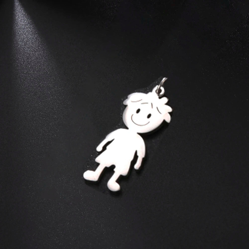 Silver pendant shaped like a cartoon character on a black background