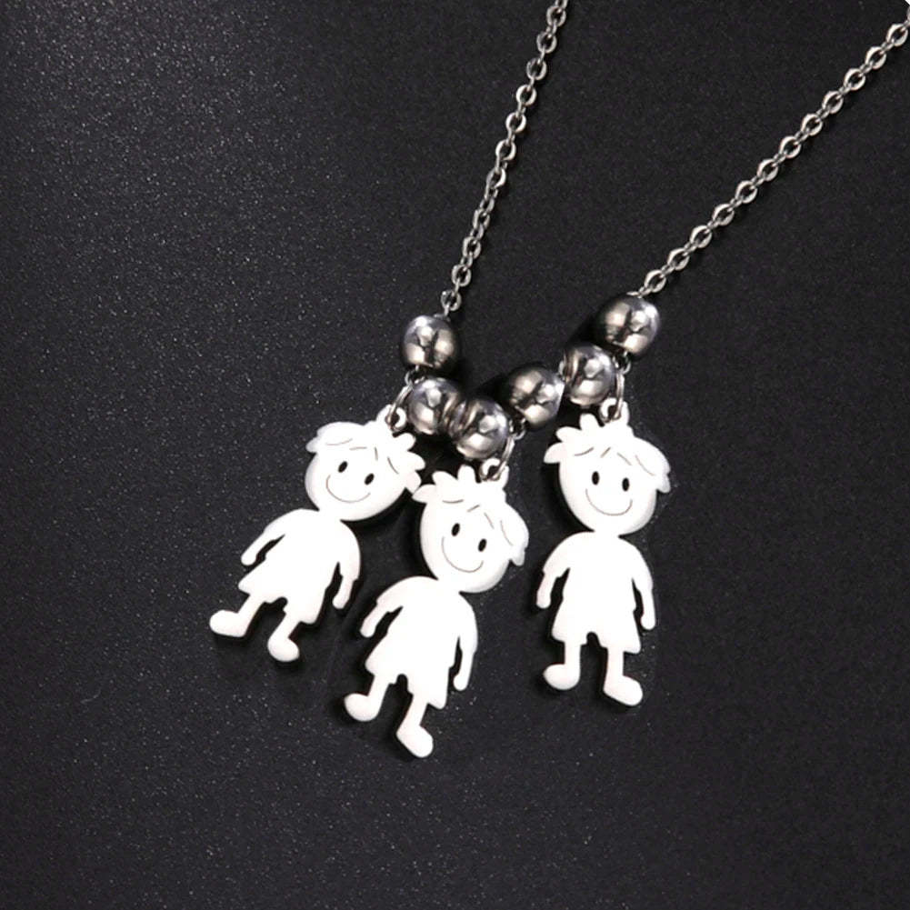 Necklace with three white cartoon-like character pendants on a black background
