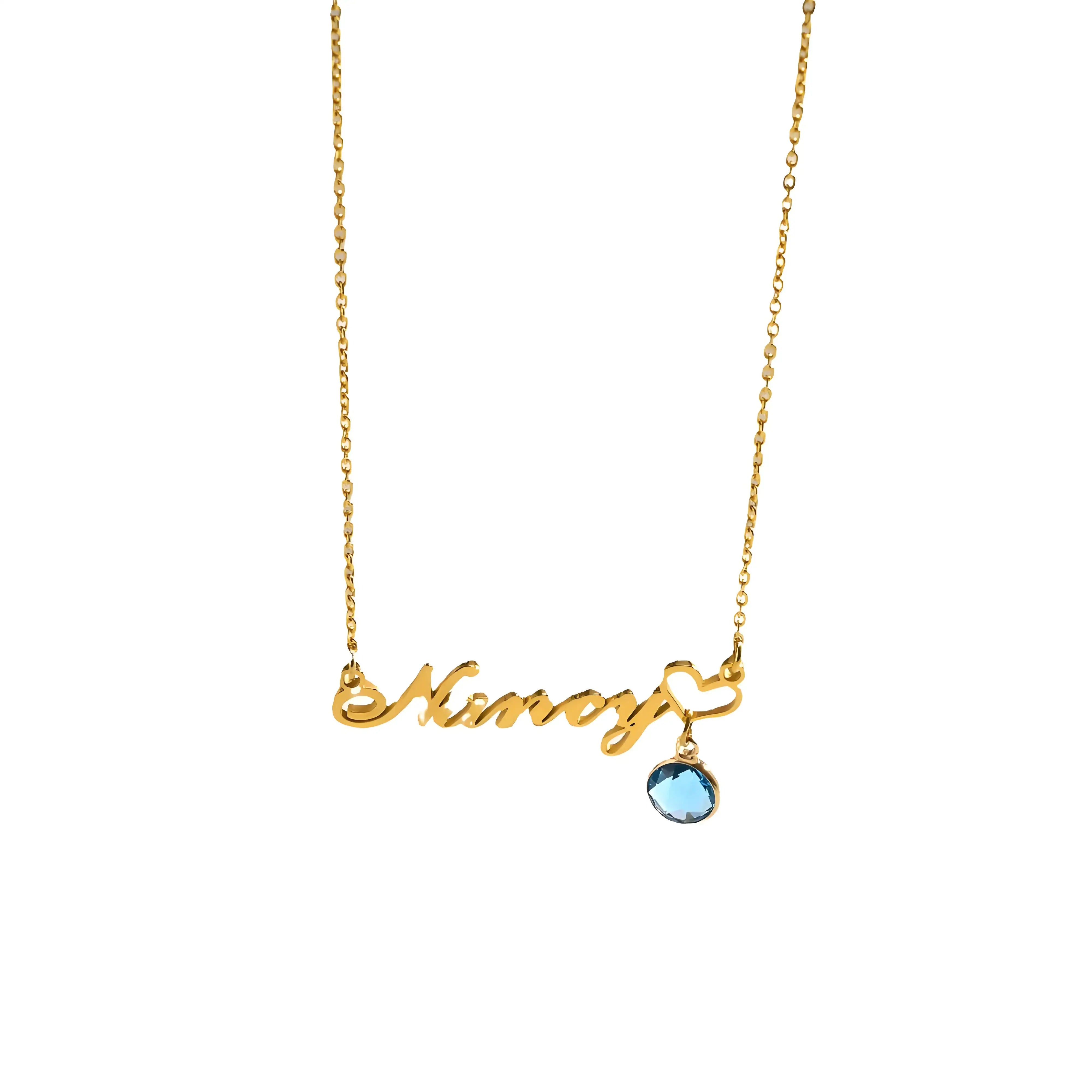 Gold necklace with 'Mom' pendant and blue gemstone on a white background