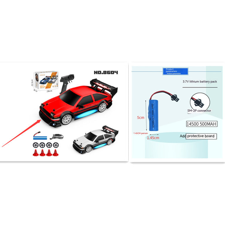 Red and black toy car with remote control, packaging, and battery pack on a white background