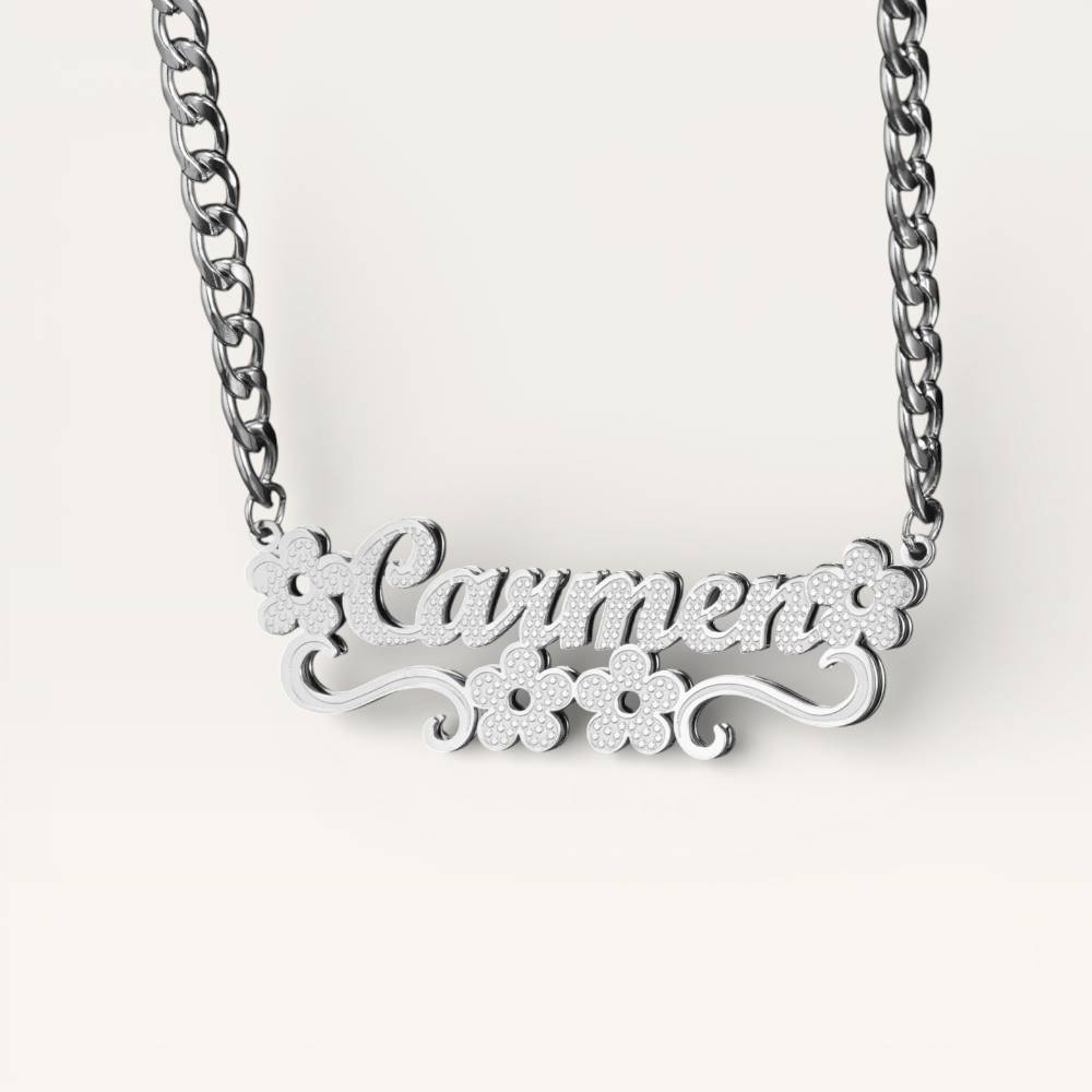 Silver necklace with 'Carmen' pendant on a white background