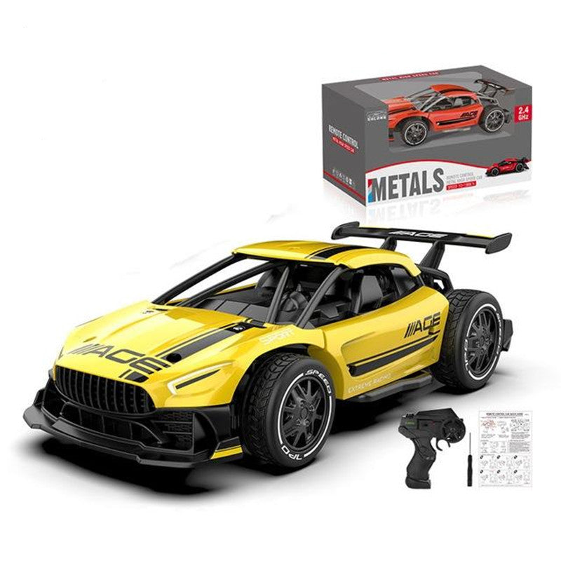 Yellow toy car with black details and a remote control, displayed with its packaging on a white background.