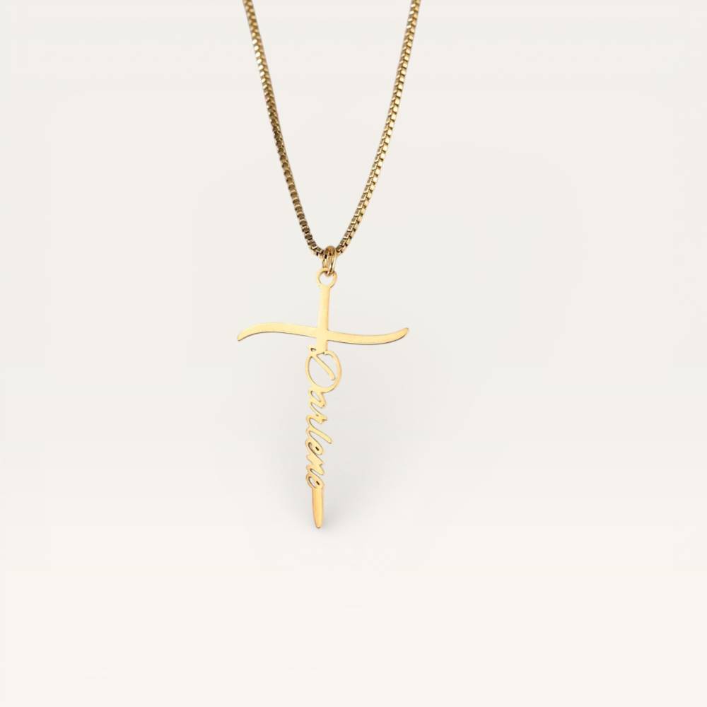Gold cross necklace with 'LOVE' pendant on a white background