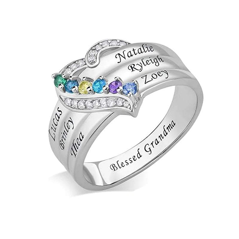 Silver ring with engraved names and colorful gemstones on a white background