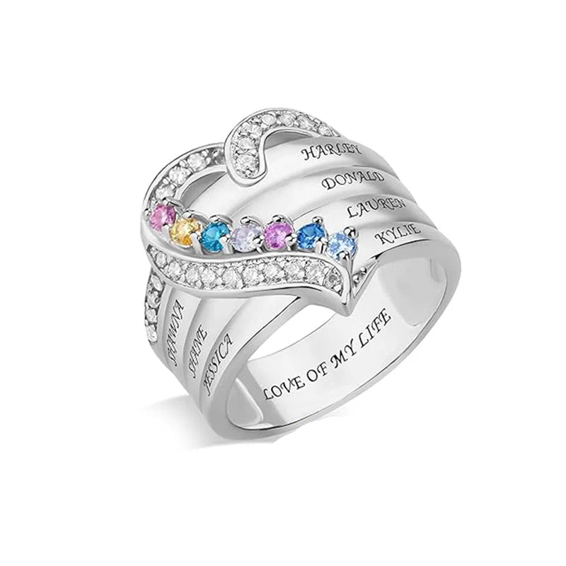 Silver ring with engraved names and colorful gemstones on a white background