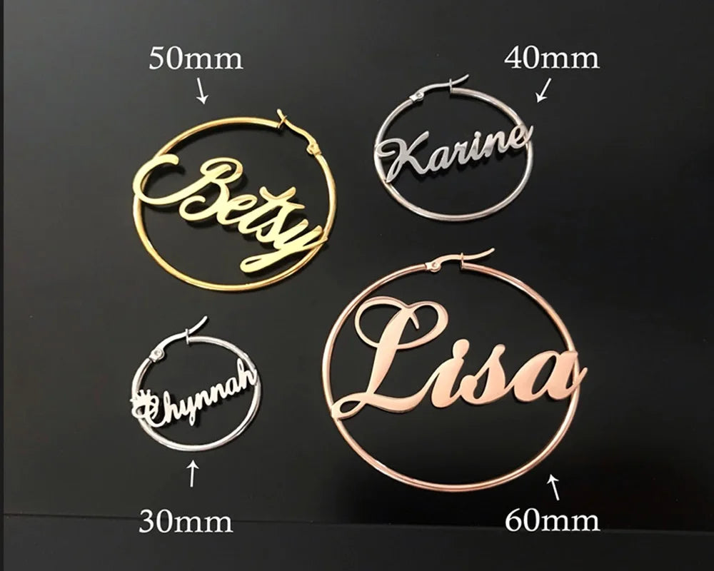 Four hoop earrings with names engraved on them, shown with measurements on a black background.