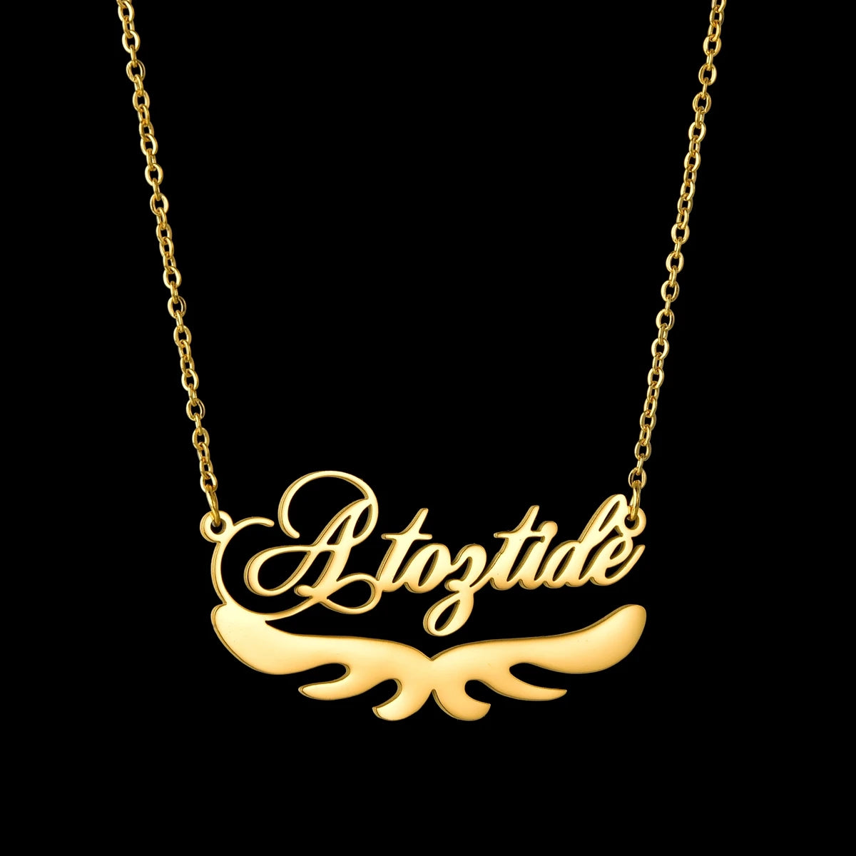 Gold necklace with 'Atoztide' pendant on a black background