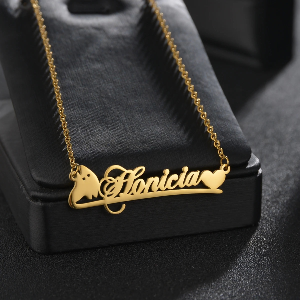 Gold necklace with 'Florancia' on a black stand