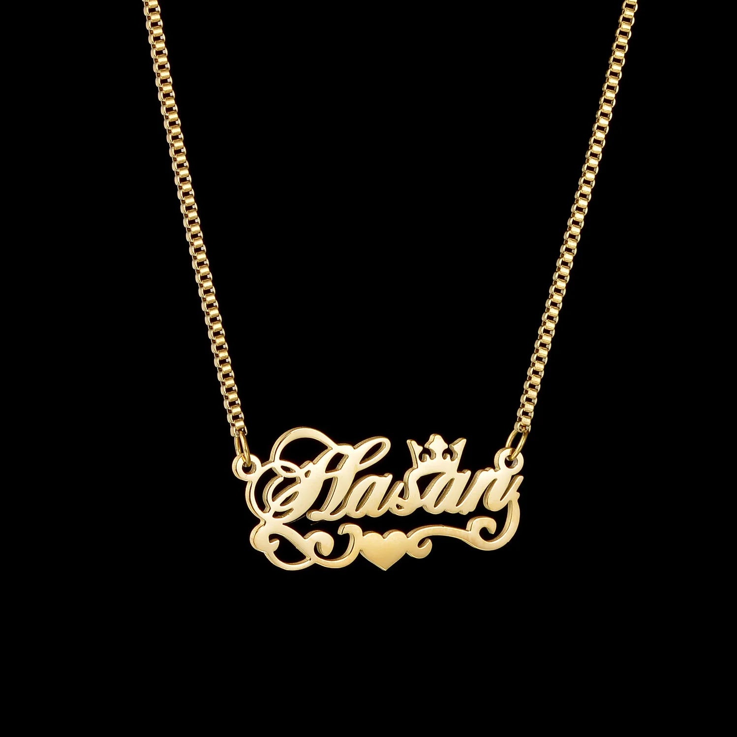 Gold necklace with 'Natalie' pendant on a black background