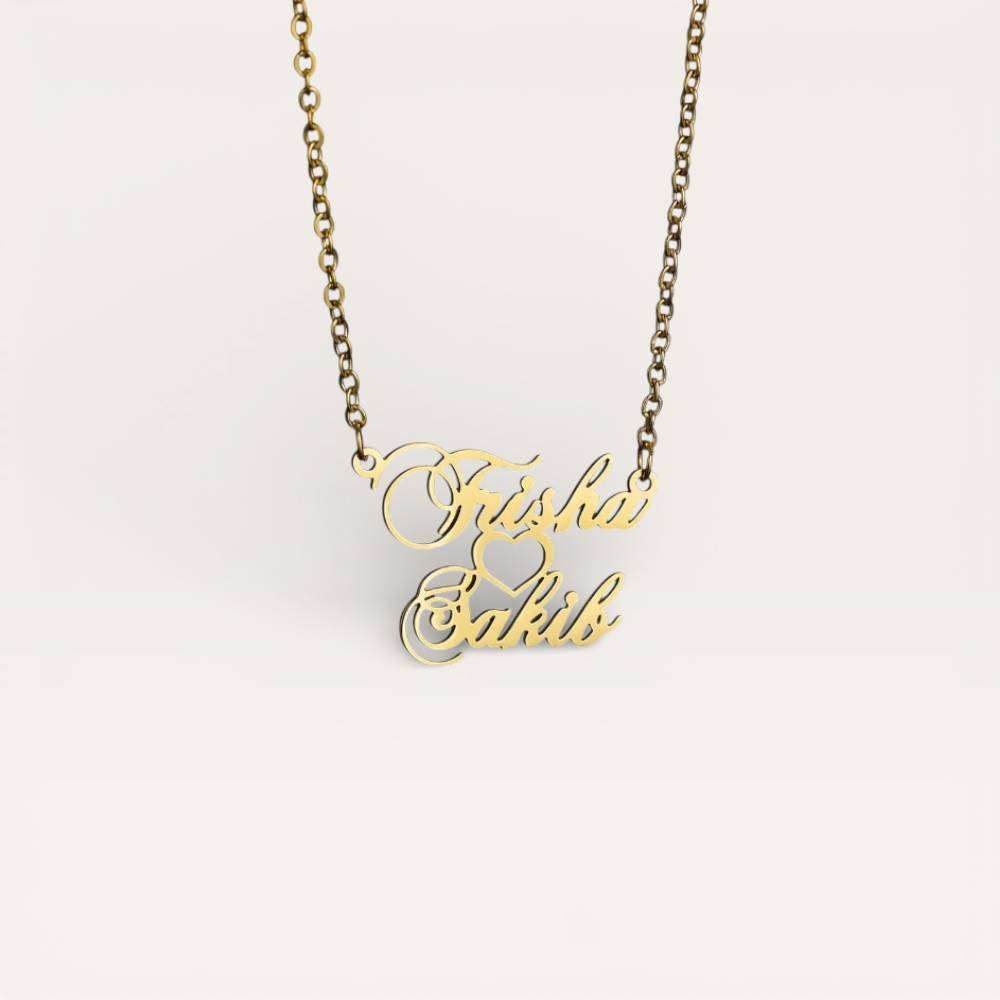 Gold necklace with 'Firda & Bakib' engraving on a light gray background