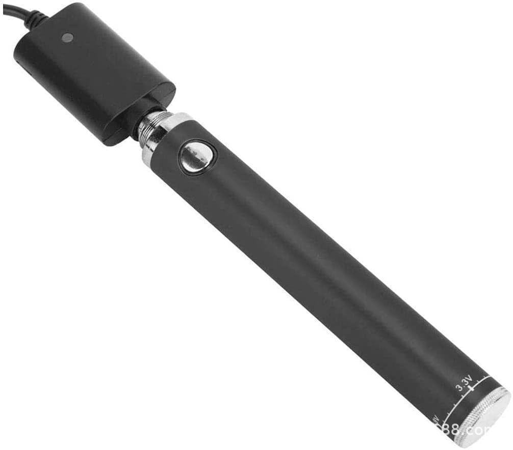 Black USB rechargeable vape battery pen with silver button and voltage markings, connected to a USB charger on a plain white background.