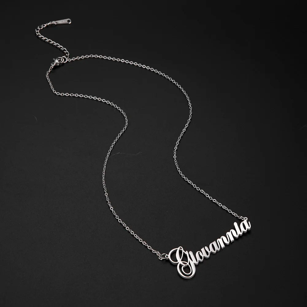Silver name necklace on a black background