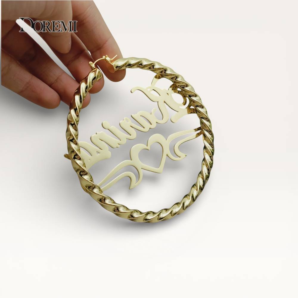 Gold chain necklace with a heart-shaped pendant on a white background