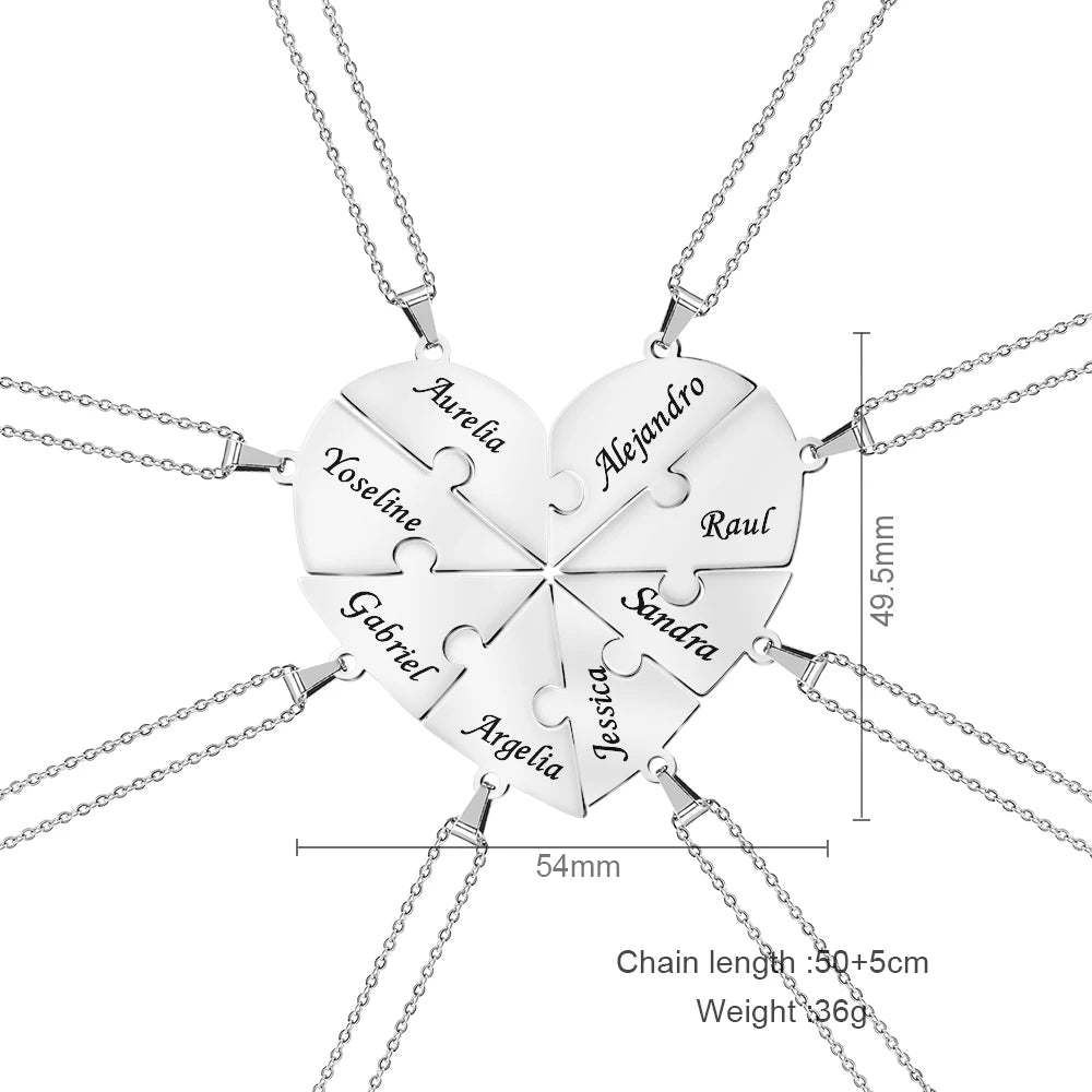 Heart-shaped puzzle piece necklace with engraved names on a white background