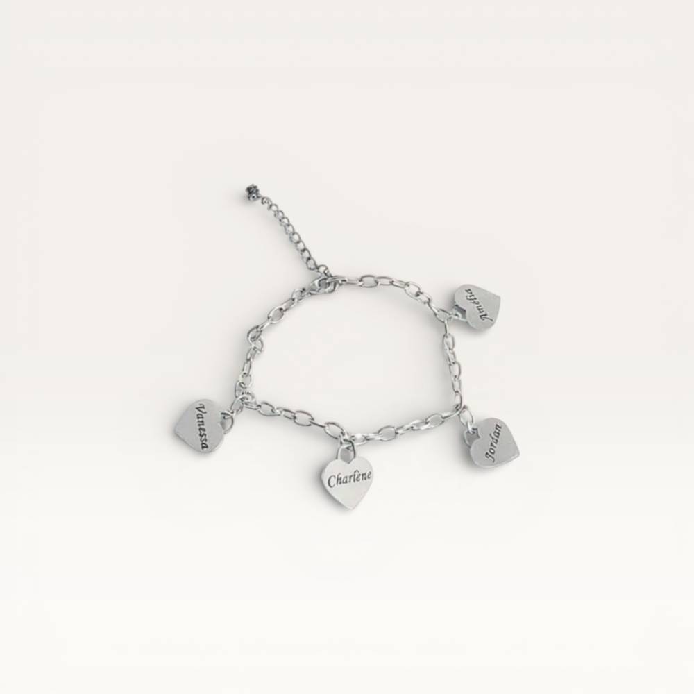 Silver bracelet with heart-shaped charms on a white background