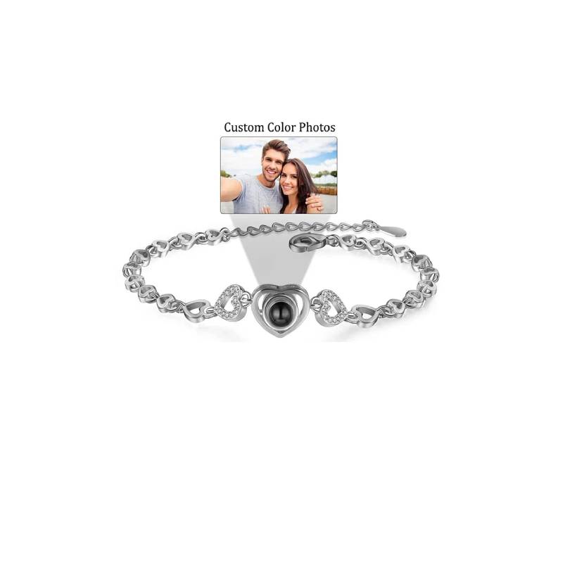 Silver bracelet with a heart-shaped charm on a white background