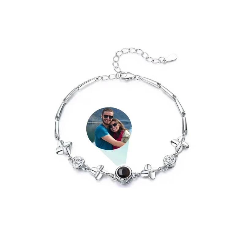 Bracelet with a photo charm featuring a couple on a white background